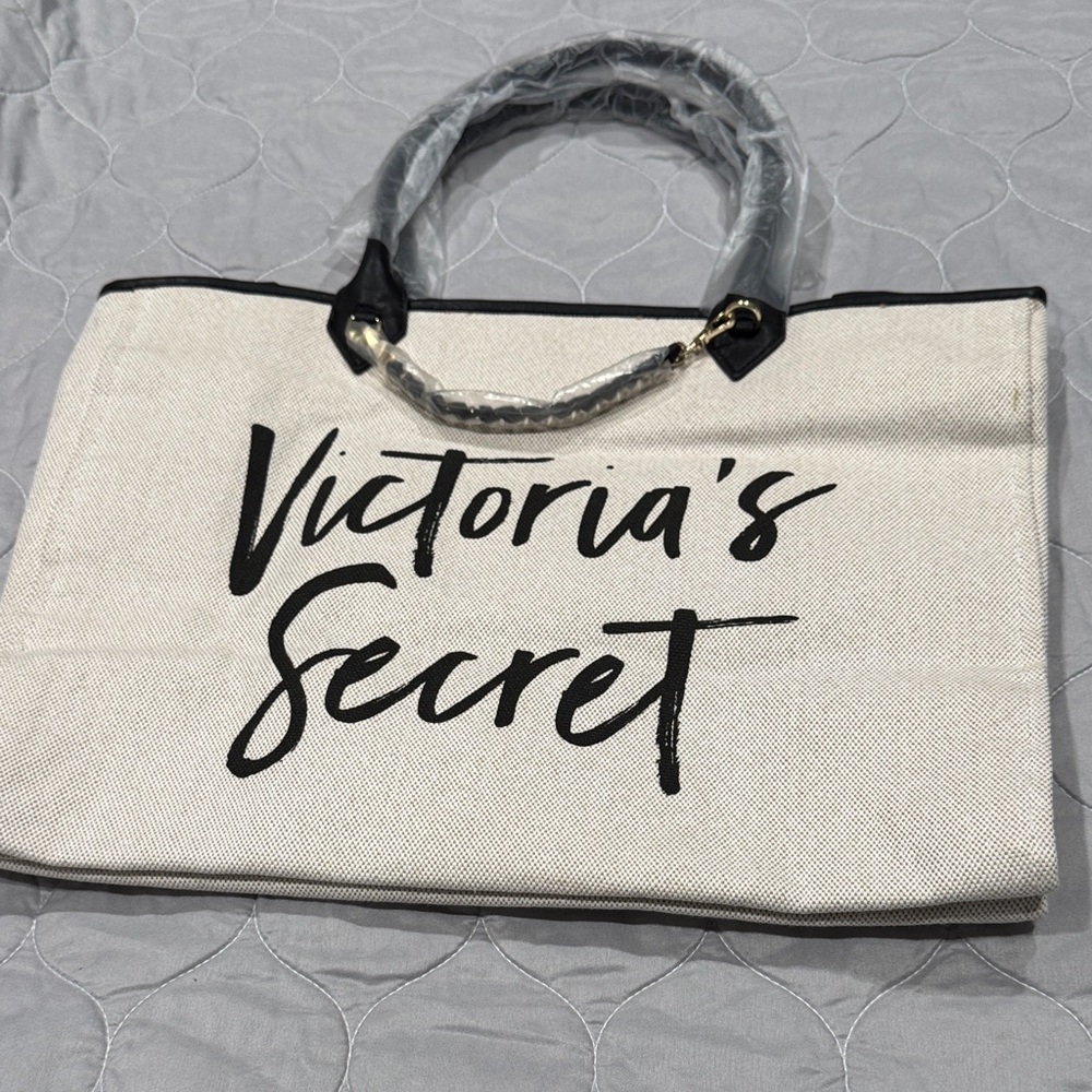 Victoria’s Secret canvas bag inside one zipper compartment lined in plastic.  P8
